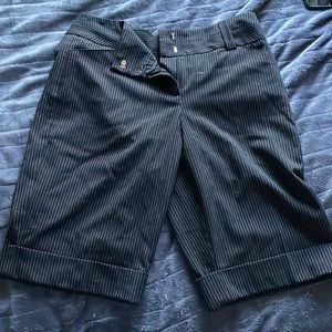 Black and white striped shorts for work.